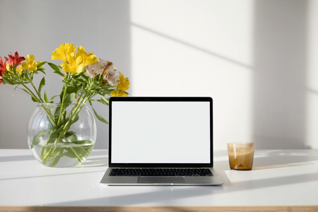 A laptop on a calm home desk, representing online CBT therapy sessions accessible from home for anxiety disorders.